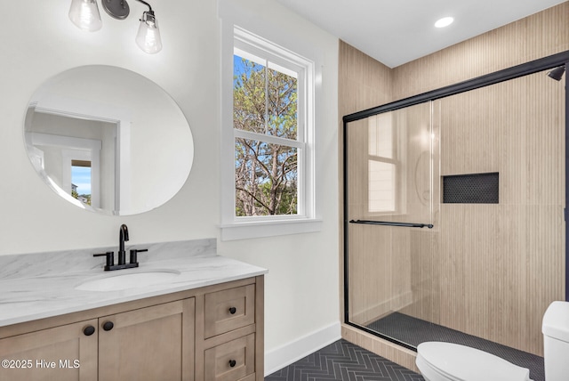 808 S 2nd St, Carolina Beach, NC 28428 - bathroom with toilet, plenty of natural light, a stall shower, vanity, and recessed lighting