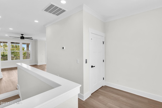 808 S 2nd St, Carolina Beach, NC 28428 - corridor with recessed lighting, wood finished floors, baseboards, and crown molding
