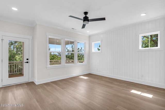 808 S 2nd St, Carolina Beach, NC 28428 - empty room featuring baseboards, wood finished floors, ornamental molding, ceiling fan, and recessed lighting