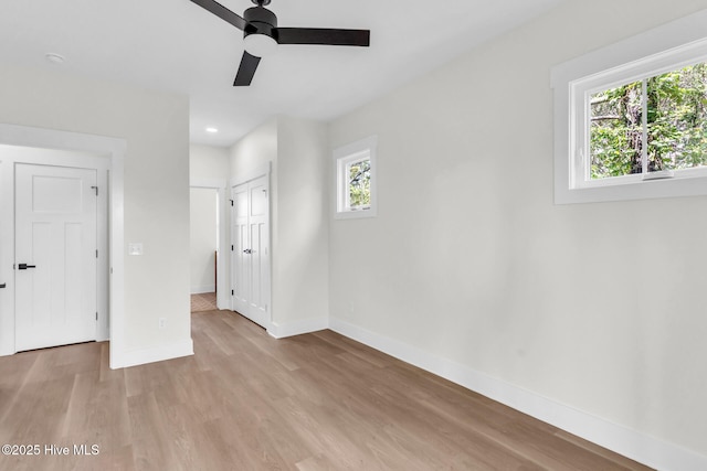 808 S 2nd St, Carolina Beach, NC 28428 - unfurnished bedroom with baseboards, light wood-style flooring, recessed lighting, ceiling fan, and a closet