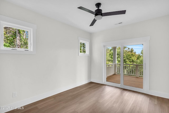 808 S 2nd St, Carolina Beach, NC 28428 - spare room with wood finished floors, baseboards, and ceiling fan
