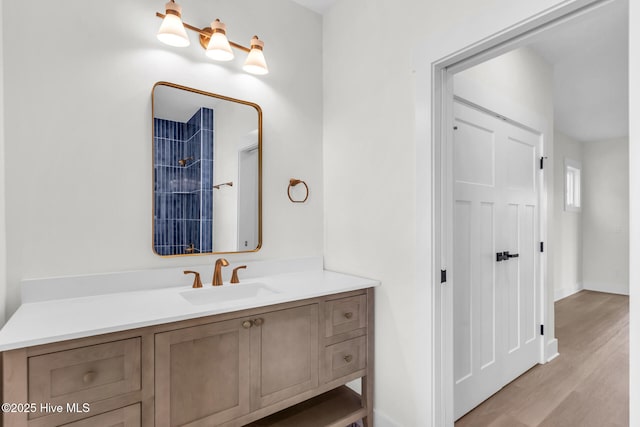 808 S 2nd St, Carolina Beach, NC 28428 - bathroom featuring vanity, wood finished floors, and baseboards