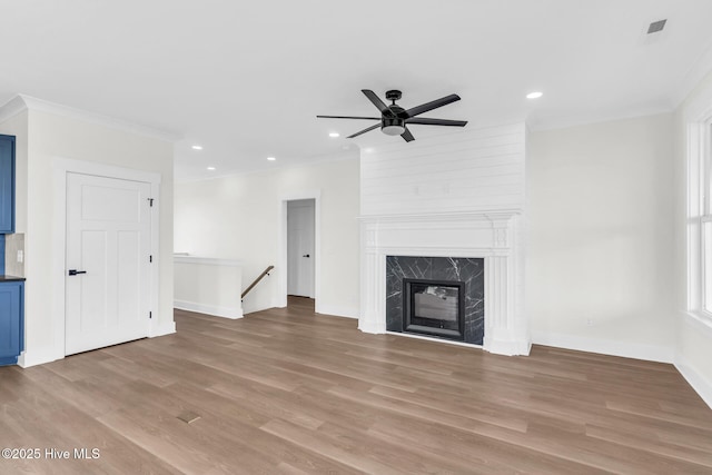 808 S 2nd St, Carolina Beach, NC 28428 - unfurnished living room with a ceiling fan, light wood-style floors, crown molding, baseboards, and recessed lighting