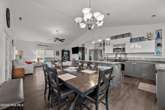 1711 S Anderson Blvd, Holly Ridge, NC 28445 - dining area featuring a chandelier, a ceiling fan, dark wood-style flooring, and high vaulted ceiling