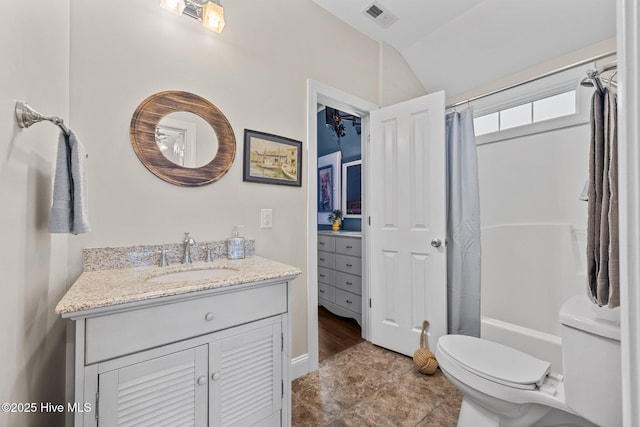 1711 S Anderson Blvd, Holly Ridge, NC 28445 - bathroom featuring toilet, vanity, vaulted ceiling, and shower / tub combo with curtain