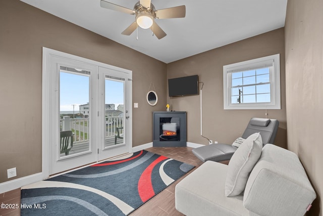 1711 S Anderson Blvd, Holly Ridge, NC 28445 - living area featuring baseboards and ceiling fan
