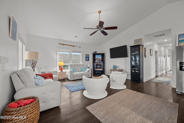 1711 S Anderson Blvd, Holly Ridge, NC 28445 - living room featuring dark wood-type flooring, ceiling fan, high vaulted ceiling, and baseboards