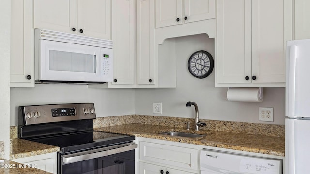 227 Foxkroft Dr Unit 9, Foxfire Village, NC 27281 - kitchen with white appliances, a sink, white cabinetry, and stone counters