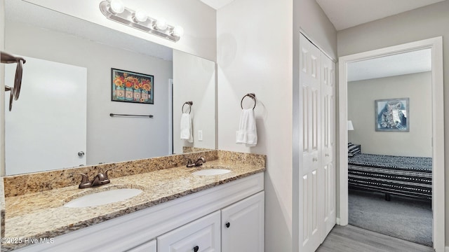 227 Foxkroft Dr Unit 9, Foxfire Village, NC 27281 - bathroom featuring wood finished floors, a closet, and double vanity