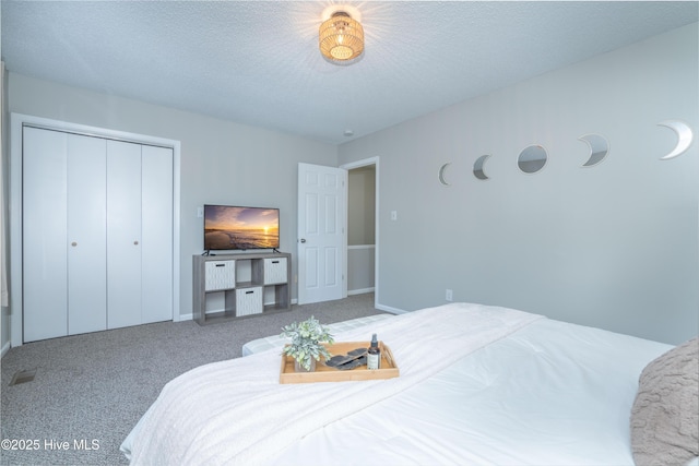 4 Port W Ct Unit C, Swansboro, NC 28584 - bedroom with carpet floors, a textured ceiling, and a closet