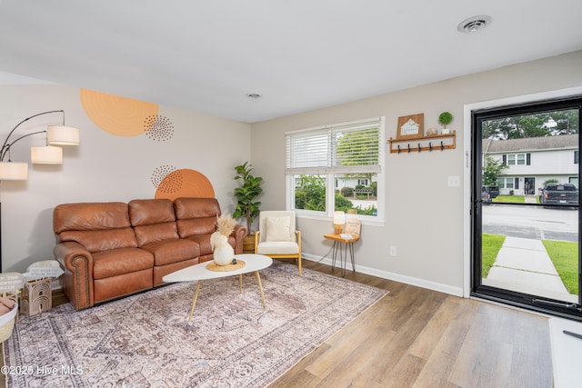 4 Port W Ct Unit C, Swansboro, NC 28584 - living area with wood finished floors and healthy amount of natural light