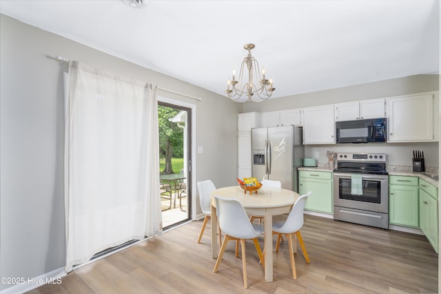 4 Port W Ct Unit C, Swansboro, NC 28584 - dining space with a chandelier and light wood finished floors