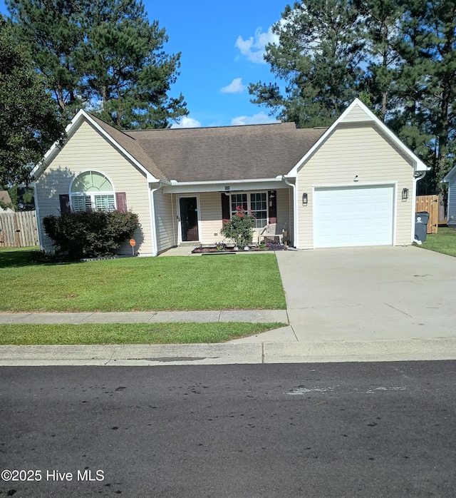 908 Edna Fields Dr, Navassa, NC 28451 - ranch-style house featuring an attached garage, concrete driveway, covered porch, and a shingled roof