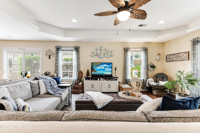 131 NE 33rd St, Oak Island, NC 28465 - living room featuring a raised ceiling, wood finished floors, a ceiling fan, and recessed lighting
