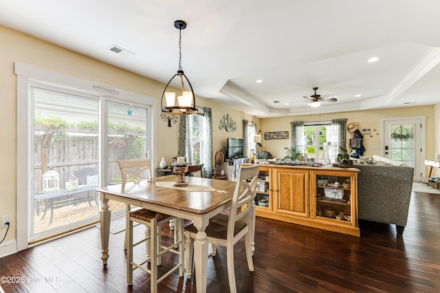 131 NE 33rd St, Oak Island, NC 28465 - dining space with a raised ceiling, dark wood-type flooring, a ceiling fan, and recessed lighting