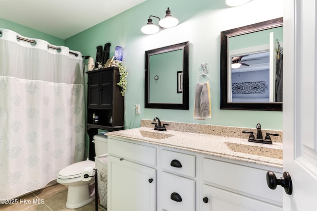 131 NE 33rd St, Oak Island, NC 28465 - full bath with toilet, double vanity, tile patterned floors, and curtained shower