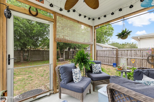 131 NE 33rd St, Oak Island, NC 28465 - sunroom with ceiling fan, plenty of natural light, and rail lighting