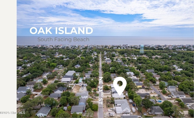 131 NE 33rd St, Oak Island, NC 28465 - aerial perspective of suburban area featuring a nearby body of water