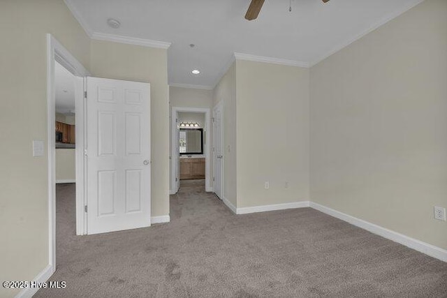 unfurnished bedroom featuring ornamental molding, carpet flooring, baseboards, recessed lighting, and ceiling fan