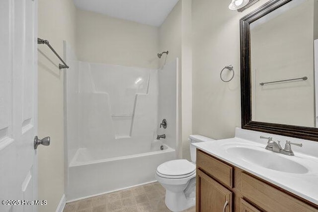 bathroom with toilet, vanity, and  shower combination