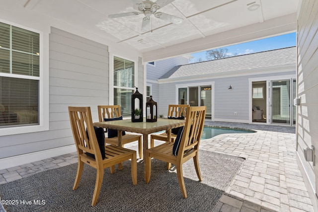view of patio / terrace with ceiling fan, an outdoor pool, and outdoor dining area