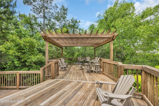 deck featuring a pergola and a fire pit