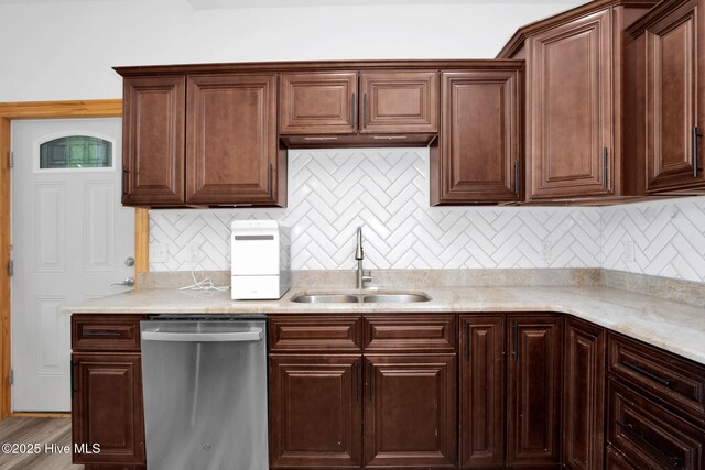 181 Kirkpatrick Ln, Red Springs, NC 28377 - kitchen with dishwasher, a sink, light countertops, and decorative backsplash