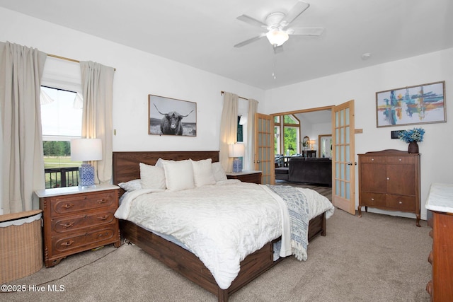 181 Kirkpatrick Ln, Red Springs, NC 28377 - bedroom with french doors, light carpet, and a ceiling fan