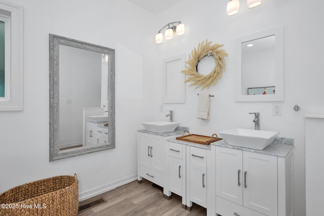 181 Kirkpatrick Ln, Red Springs, NC 28377 - full bath with double vanity, wood finished floors, and baseboards