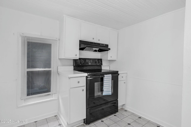 kitchen with black electric range, under cabinet range hood, light countertops, white cabinets, and baseboards