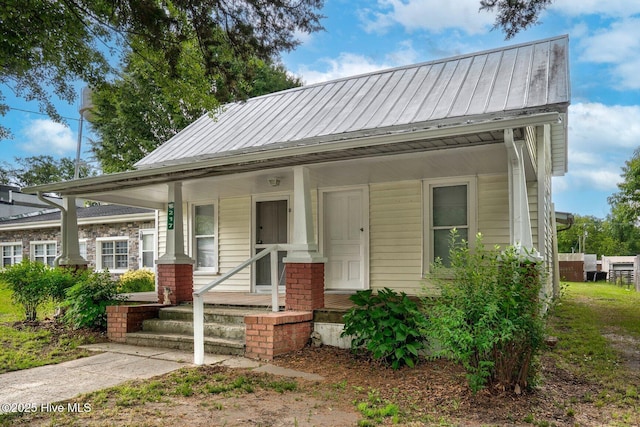 view of front of property with a standing seam roof and metal roof