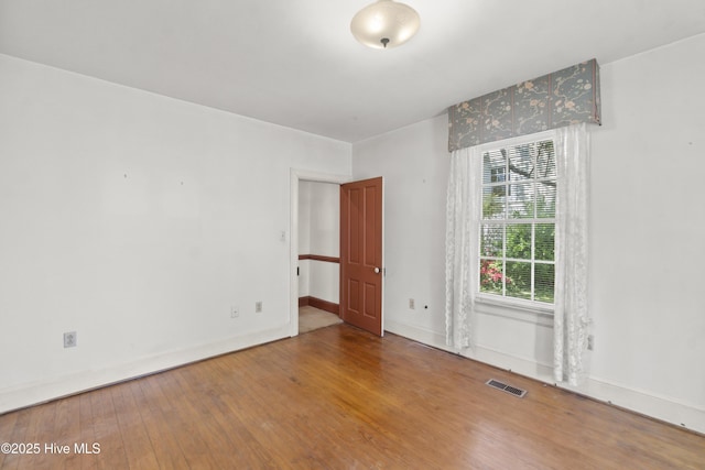 306 S Oakum St, Edenton, NC 27932 - empty room with wood finished floors and baseboards