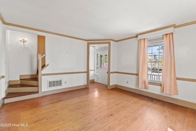 306 S Oakum St, Edenton, NC 27932 - empty room featuring wood finished floors, crown molding, stairway, and baseboards