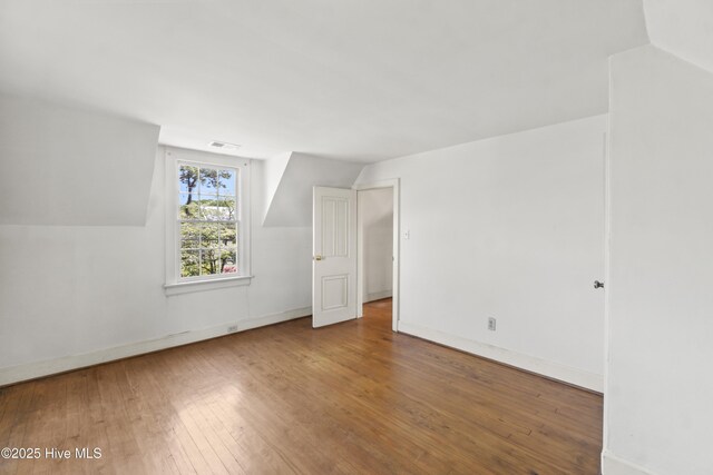 306 S Oakum St, Edenton, NC 27932 - additional living space with hardwood / wood-style flooring, baseboards, and lofted ceiling