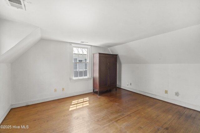 306 S Oakum St, Edenton, NC 27932 - additional living space featuring hardwood / wood-style floors, vaulted ceiling, and baseboards