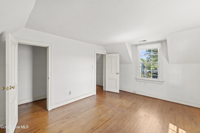 306 S Oakum St, Edenton, NC 27932 - bonus room featuring hardwood / wood-style floors, lofted ceiling, and baseboards