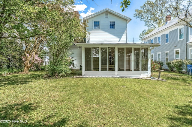 306 S Oakum St, Edenton, NC 27932 - rear view of house featuring a sunroom and a yard