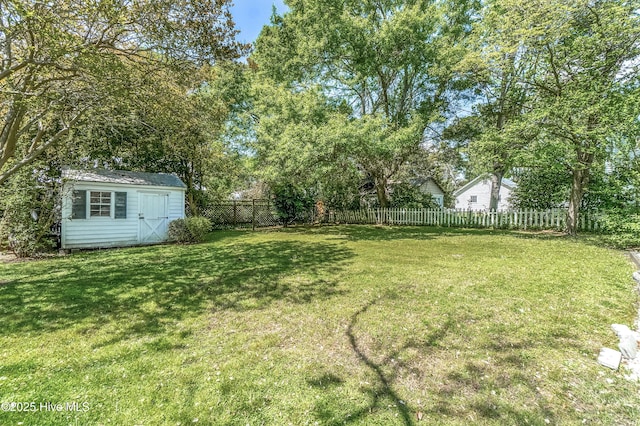 306 S Oakum St, Edenton, NC 27932 - view of yard with a storage unit and an outbuilding