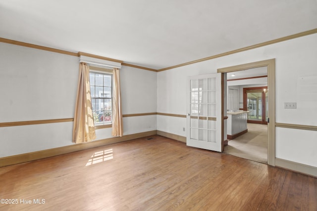 306 S Oakum St, Edenton, NC 27932 - empty room with crown molding, wood finished floors, baseboards, and french doors