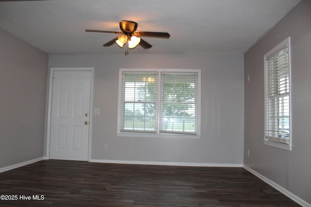 118 Turtle Shell Rd, Richlands, NC 28574 - empty room with dark wood-style floors, ceiling fan, plenty of natural light, and baseboards