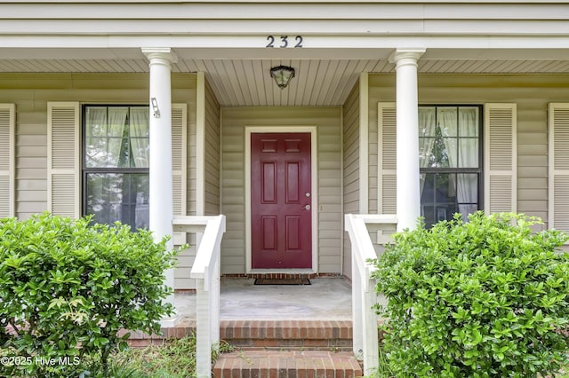 property entrance with covered porch