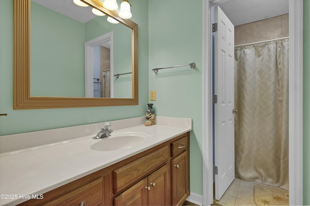 full bathroom featuring vanity and tile patterned floors