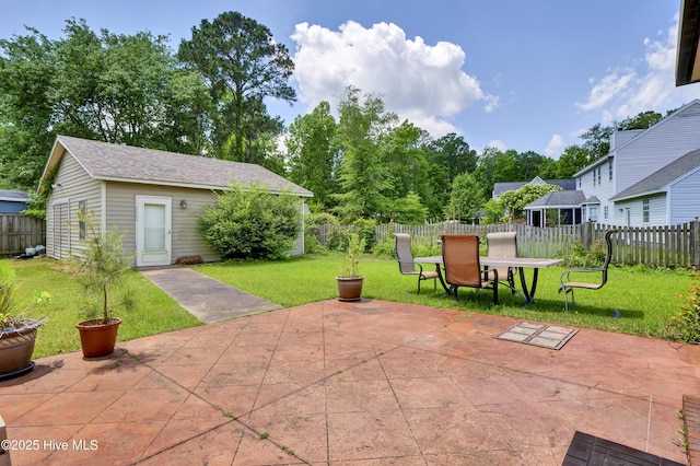 view of patio with outdoor dining area and an outdoor structure