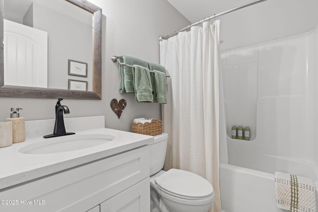 full bathroom featuring toilet, vanity, and shower / bath combination with curtain