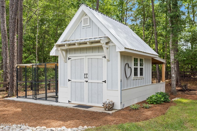 view of shed featuring fence