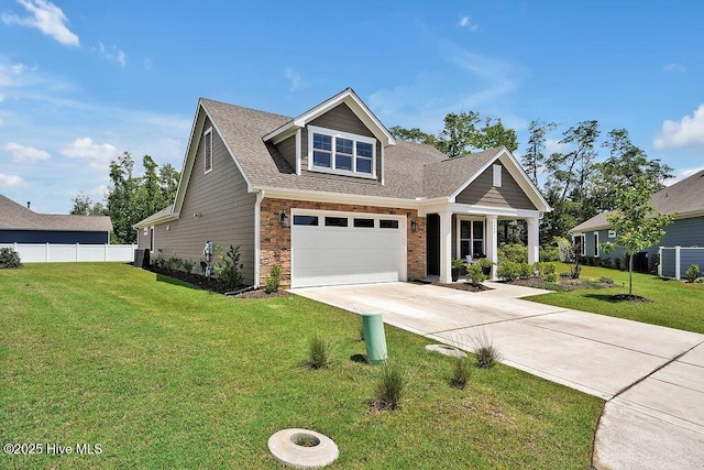 craftsman inspired home with driveway, an attached garage, stone siding, and a shingled roof