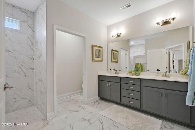 bathroom featuring marble look tiles, double vanity, walk in shower, baseboards, and toilet