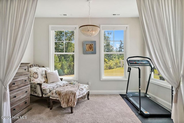 sitting room with baseboards and plenty of natural light