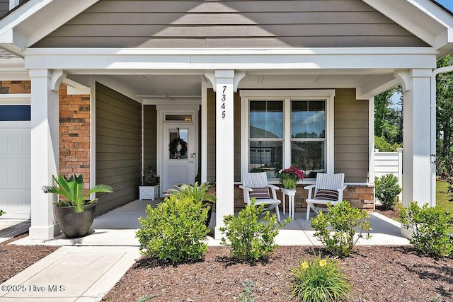 doorway to property with a porch