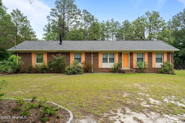 single story home with brick siding, a front lawn, entry steps, and a shingled roof